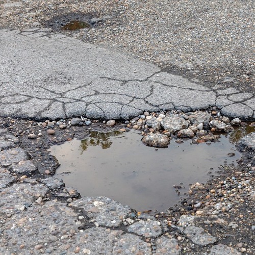 view from above of a pothole in the road