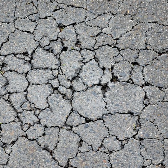 cracks along asphalt