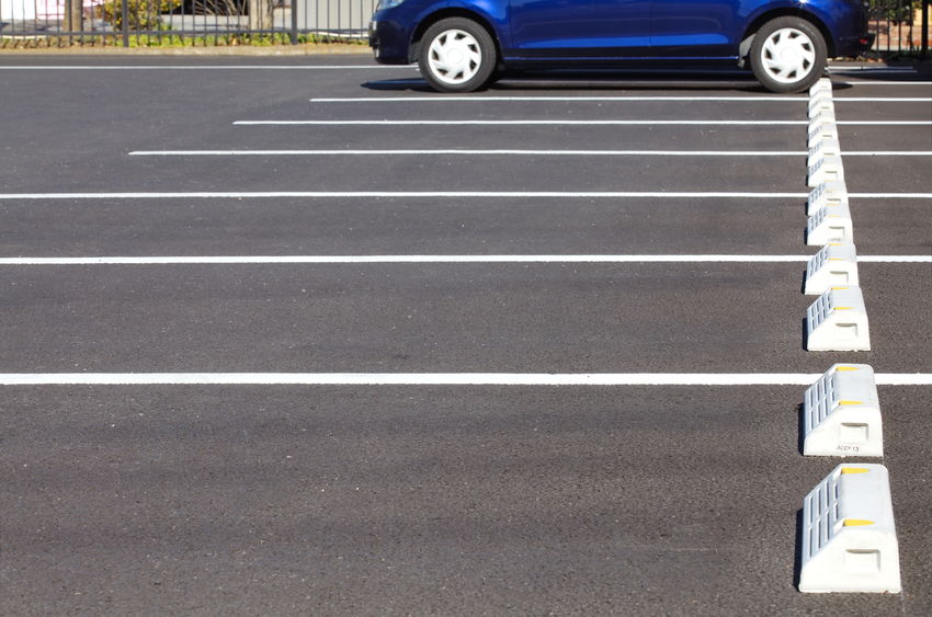 A Picture of a Car Parked at an Asphalt Parking Lot.