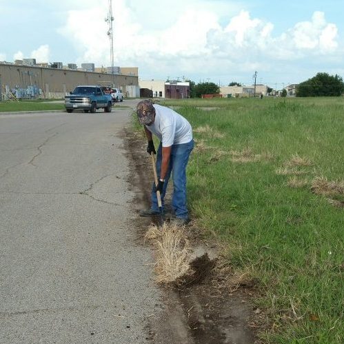 A Picture of a Man Prepping for Concrete Curbing.