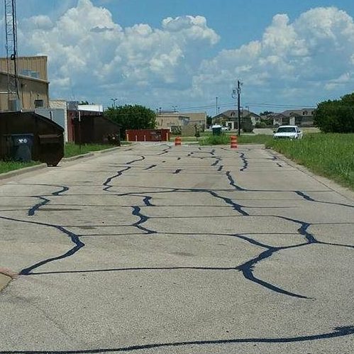 A Picture of Many Pavement Stripes On the Ground.