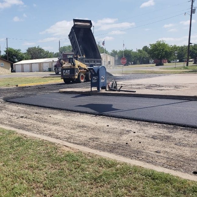 Paving Truck Dumping Asphalt