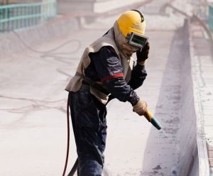 Sand Blasting a Concrete Surface Abrasive Removal
