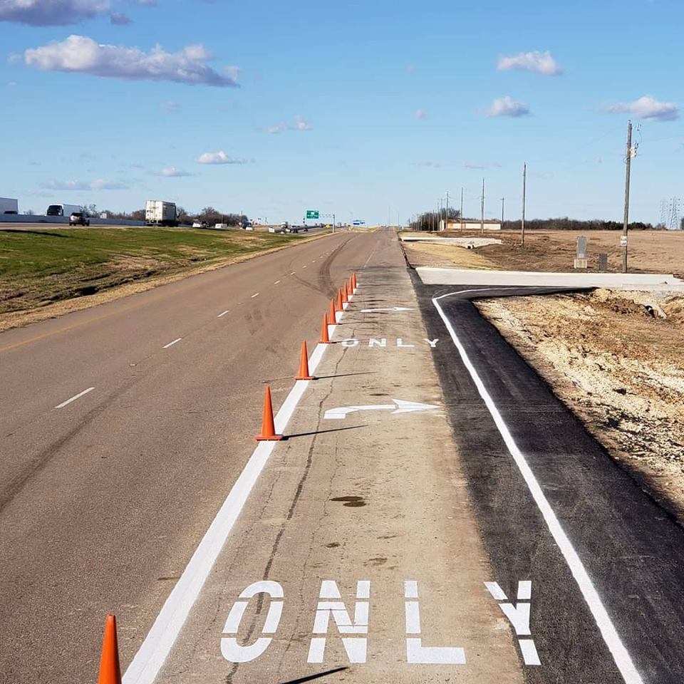 A Picture of a Turn Only Signal On Road.